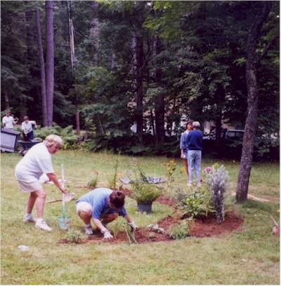 Volunteers working near pond